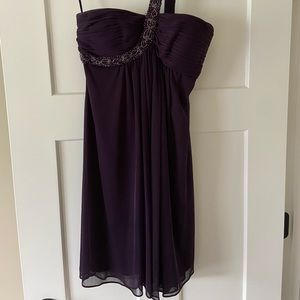 Beautiful formal dress. Strapless with beading cross strap. Size 6. Like new.